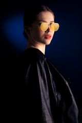 minimal portrait with yellow glasses and red lipstick