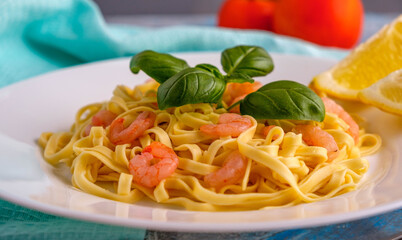 Pasta with shrimps, basil and tomatoes