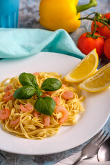 Pasta with shrimps, basil and tomatoes