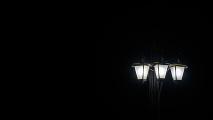 Street lanterns in dark. Night lights illuminate at the night. Image for design. Space for text.