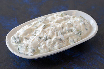 healthy vegetarian food, purslane salad with yoghurt. Traditional Middle Eastern Appetizer