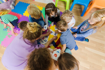 Educational group activity at the kindergarten or daycare - 418956109