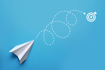 A paper airplane and a route to the goal. The symbol of fast movement to the intended goal