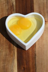 Double-yolker egg in heart dish