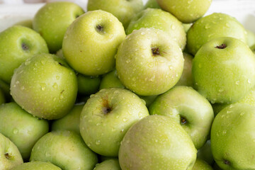 Lots of fresh green apples close together