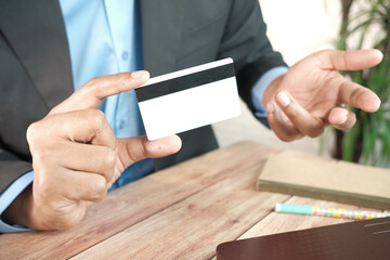 young man hand showing credit card and frustration 