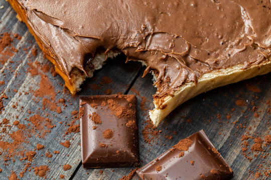 Chocolate spread on bread with a knife. This chocolate is made from hazelnuts and hazelnut paste. The taste of chocolate is very good. 
