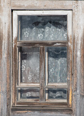 Old wooden window. Vintage frame texture with peeling paint.