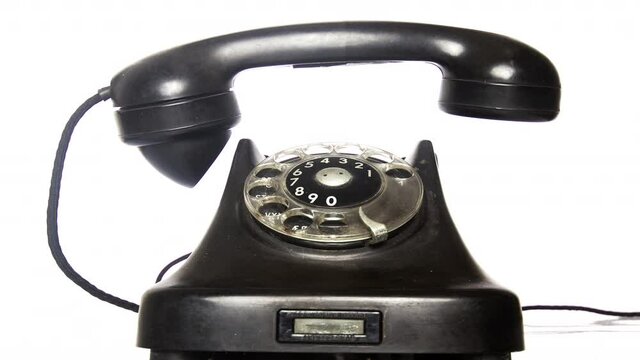 the vintage black phone ringing slowly to fast  isolated on white stop motion