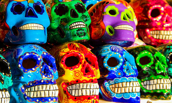 Calacas, wooden skull Day of the Dead masks on market in Cabo San Lucas, Mexico