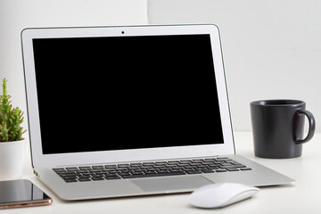 White desk office with laptop, smartphone and other work supplies with cup of coffee. Designer workspace on desk table essential elements on flat lay