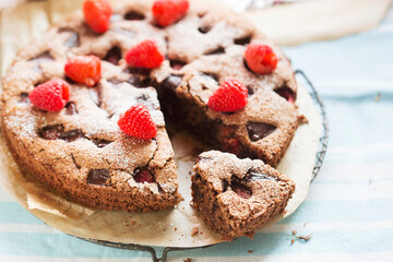 Chocolate tart with almond meal, dark chocolate and raspberries 
