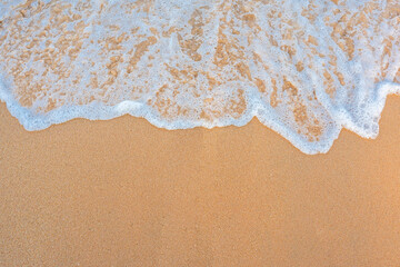 Fototapeta na wymiar Sea wave and sand beach background
