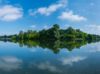 Clouds reflected at Loire River, La Chapelle-aux-Naux, Indre-et-Loire Department, The Loire Valley, France, Europe