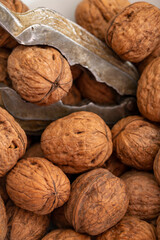 Close-up walnuts pile. Walnut cracker