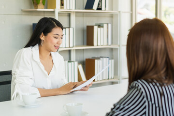 Happy,Smile young asian manager, employer woman, man interview with person, have question about resume and listen to candidate answer, conversation together at office.Recruitment employee job concept.