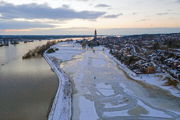 Aerial from the snowy city Rhenen in the Netherlands in winter