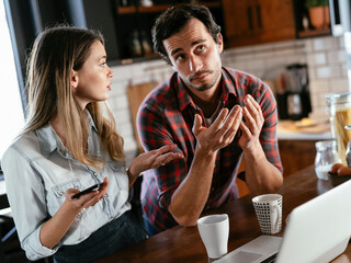 Boyfriend and girlfriend are arguing. Jealous girlfriend having an argument with her boyfriend