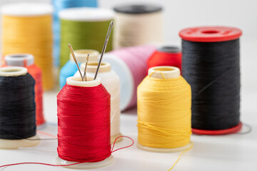 Different colored yarn on white background. Close up. Selective Focus