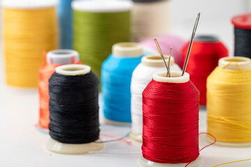 Different colored yarn on white background. Close up. Selective Focus