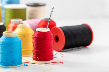 Different colored yarn on white background. Close up. Selective Focus