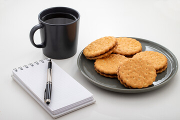 Work desk. With Coffee, Biscuits and notepad