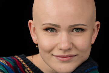 Young urban woman with blue eyes and a fair complexion poses for the camera.