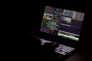 A computer programmer and hacker prints a code on a laptop keyboard to break into a mysterious...