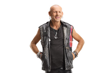 Bald punk in leather clothes standing and smiling