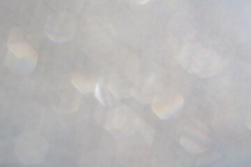 Bokeh background with beautiful silver text effect. Blurred circles, colorful pattern with space art. Place for text