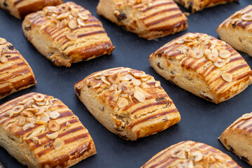 Homemade fresh raisin on cookies with nut particles. close up