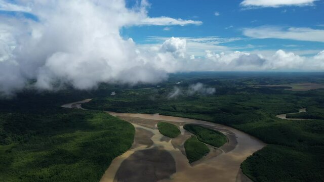 Beautiful aerial view of mangroves with islands muddy river blue sky white clouds Costa Rica Zancudo