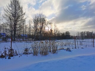 Fototapeta na wymiar Winter landscape Russian village frosty day in winter