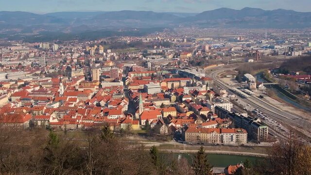 Aerial view to the city Celje in Slovenia. Red roofs, river and the bridge.