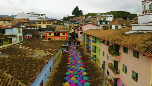 Establishing Aerial Shot of City Street with Colorful Umbrellas in South America. Guatape, Antioquia, Colombia.