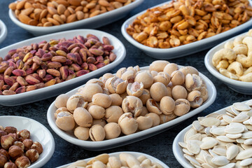 Topy fıstık or peanuts in selective focus. Types of nuts found in bulk on a dark background