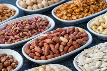 Peanuts in selective focus. Types of nuts found in bulk on a dark background
