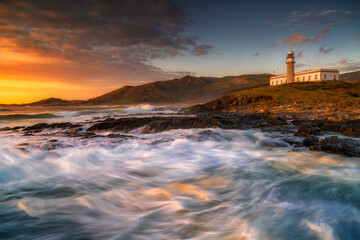 Obraz na płótnie Canvas Lariño or Punta Insua lighthouse at sunset. Carnota, Galicia, Spain