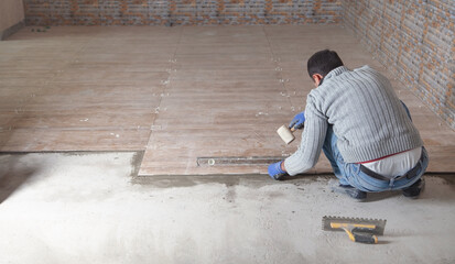 Laying floor ceramic tile. Renovating the floor