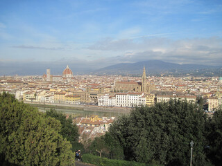 Fototapeta na wymiar Panoramic Florence cityscape. View of the River Arno in the morning. Scenic landscape with Ponte Vecchio. Travel to European Union. UNESCO World Heritage Site.