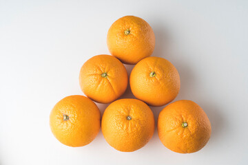 fresh oranges on a white background close up