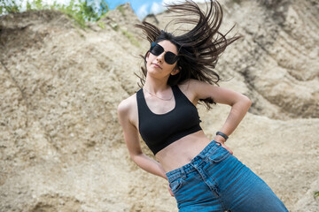 beautiful brunette lady in sand quarry relax and enjoy her time on summer day