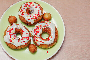 Traditional pastries. Homemade donuts. Photo 9: ready-made fried donuts garnished with custard.