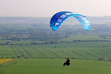 Paraglider flying at Milk Hill, Wiltshire	