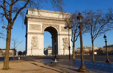 The Triumphal Arch in sunny day, Paris, France.