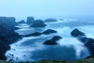 Stormy coastal landscape of Arnarstapi at night