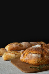 Bread and baguette on dark background