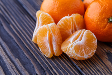 Mandarine orange or tangerine on wooden board