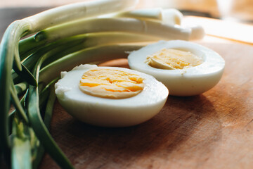 Boiled eggs with green onions. Ingredients for the spring salad. Healthy food.