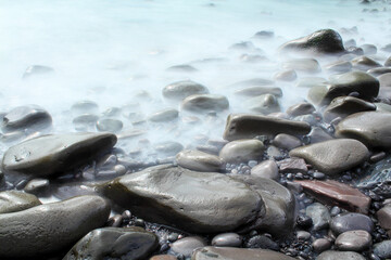 Fototapeta premium Time exposure of stones at the beach of Hellnar, Snaeffelsnes National Park in Iceland